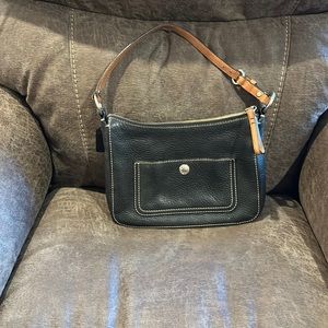 Coaches, black hand held purse with front pocket, trimmed in brown strap